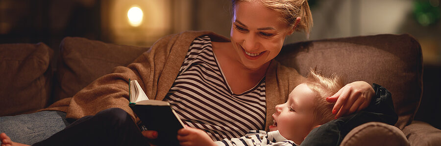 a mom and a child reading a book