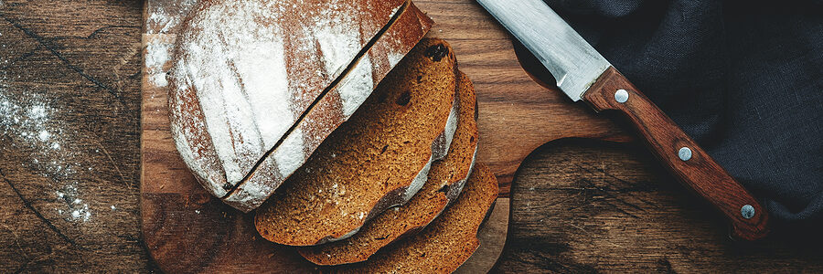 Slices of rye bread on cutting board