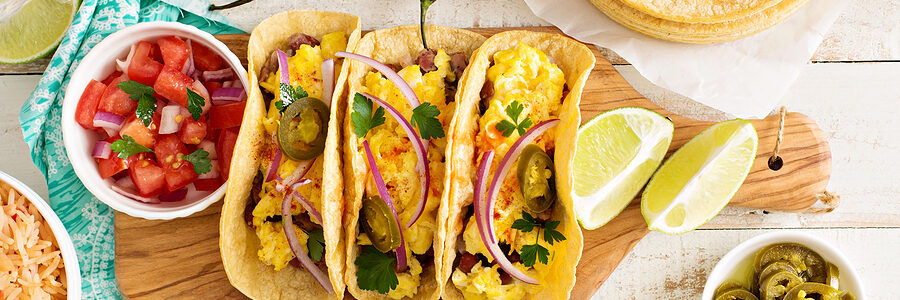Breakfast tacos on wooden board