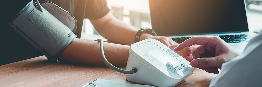 Woman having her blood pressure checked.