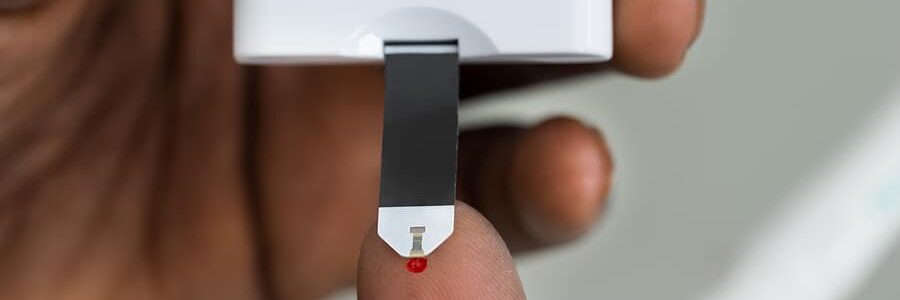 Man checking his blood sugar level
